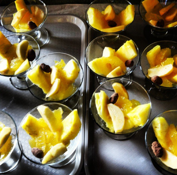 chocolate covered cacao atop fruit at a cacao farm