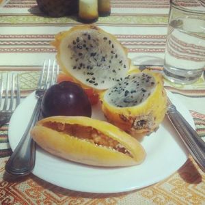 Pitahaya fruit with black seeds, and taxa fruit with an oblong shape