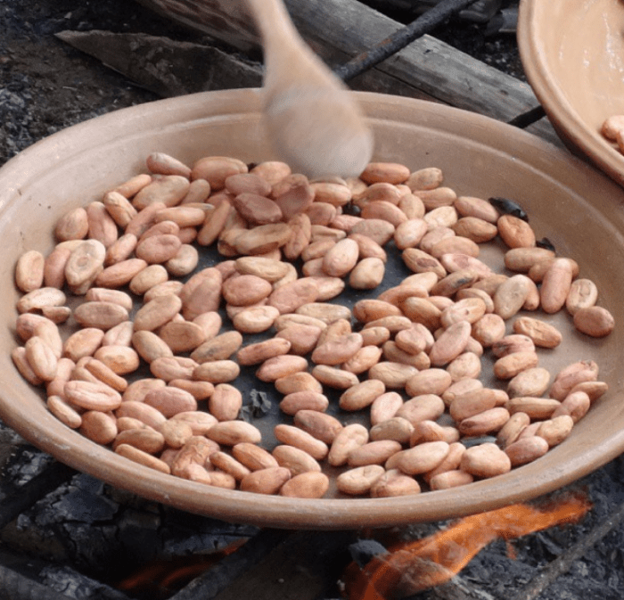 roasting cacao on a farm in ecuador