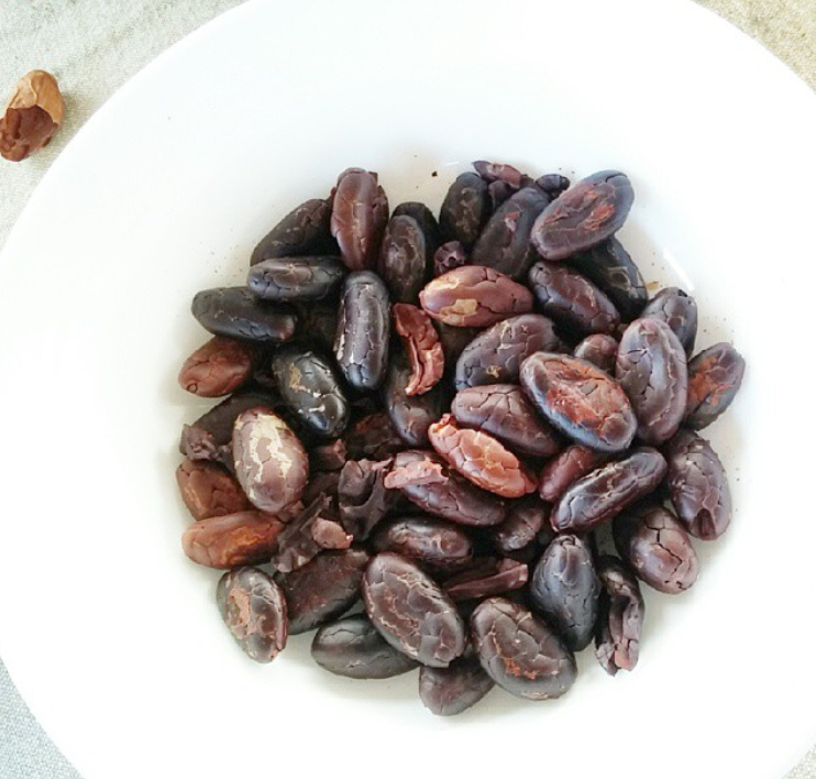 shelling cacao by hand on a farm in ecuador