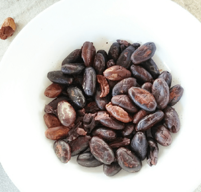 shelling cacao by hand on a farm in ecuador