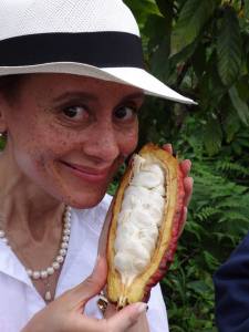 With a freshly opened cocoa pod on a Pacari family farm