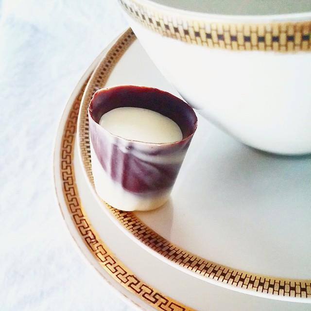 The Vietnamese Ice Coffee: chocolate ganache, with coffee and milk, in a dark chocolate cup.