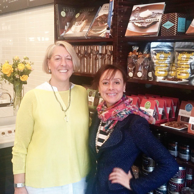 with Cocoa + Co. owner Kim Hack (left) on opening day at her shop