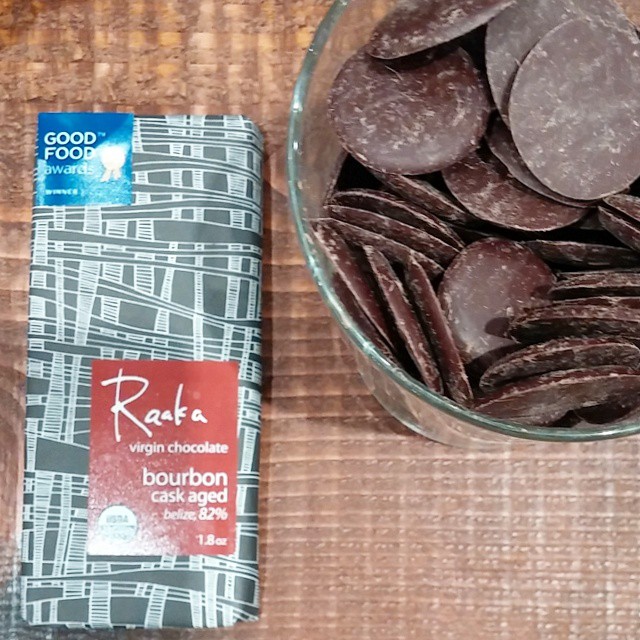 Raw craft chocolate by Raaka, Belize origin, aged in bourbon casks, for a rich and appealing intensity