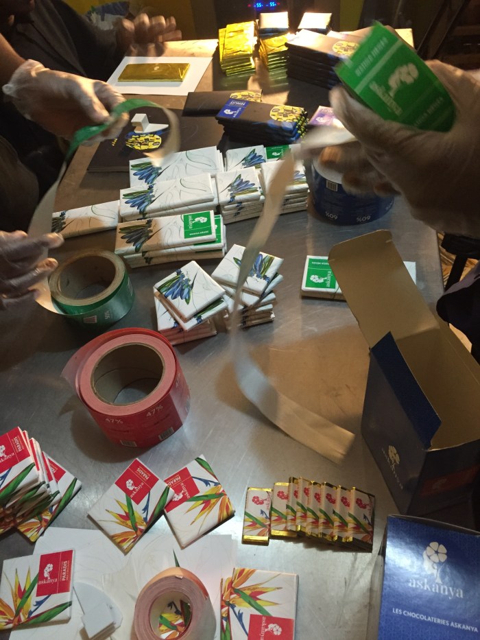 photo of hands wrapping chocolate